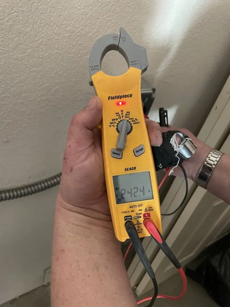 Voltage testing with clamp meter during Outlet Installation in Roswell